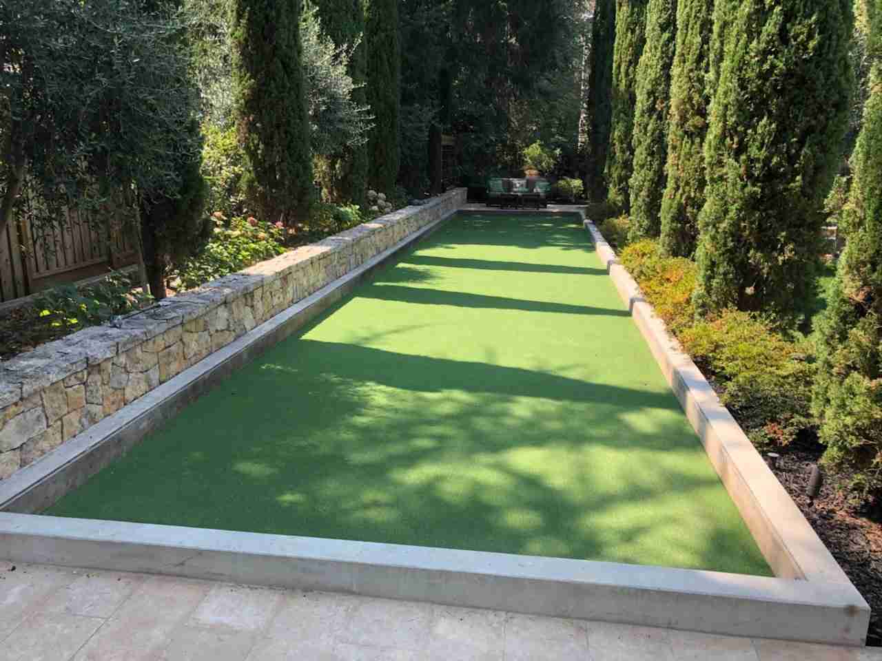 Bocce court with pressure-treated timber border boards